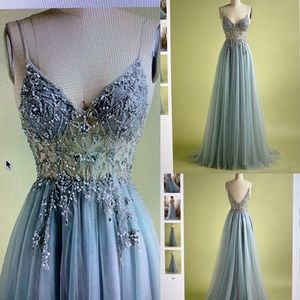Stunning light blue princess prom dress with a beaded corset top